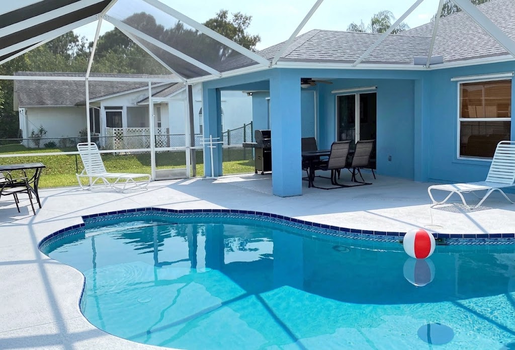 Screened heated pool and patio at a Florida Vacation Home rental in Port St Lucie