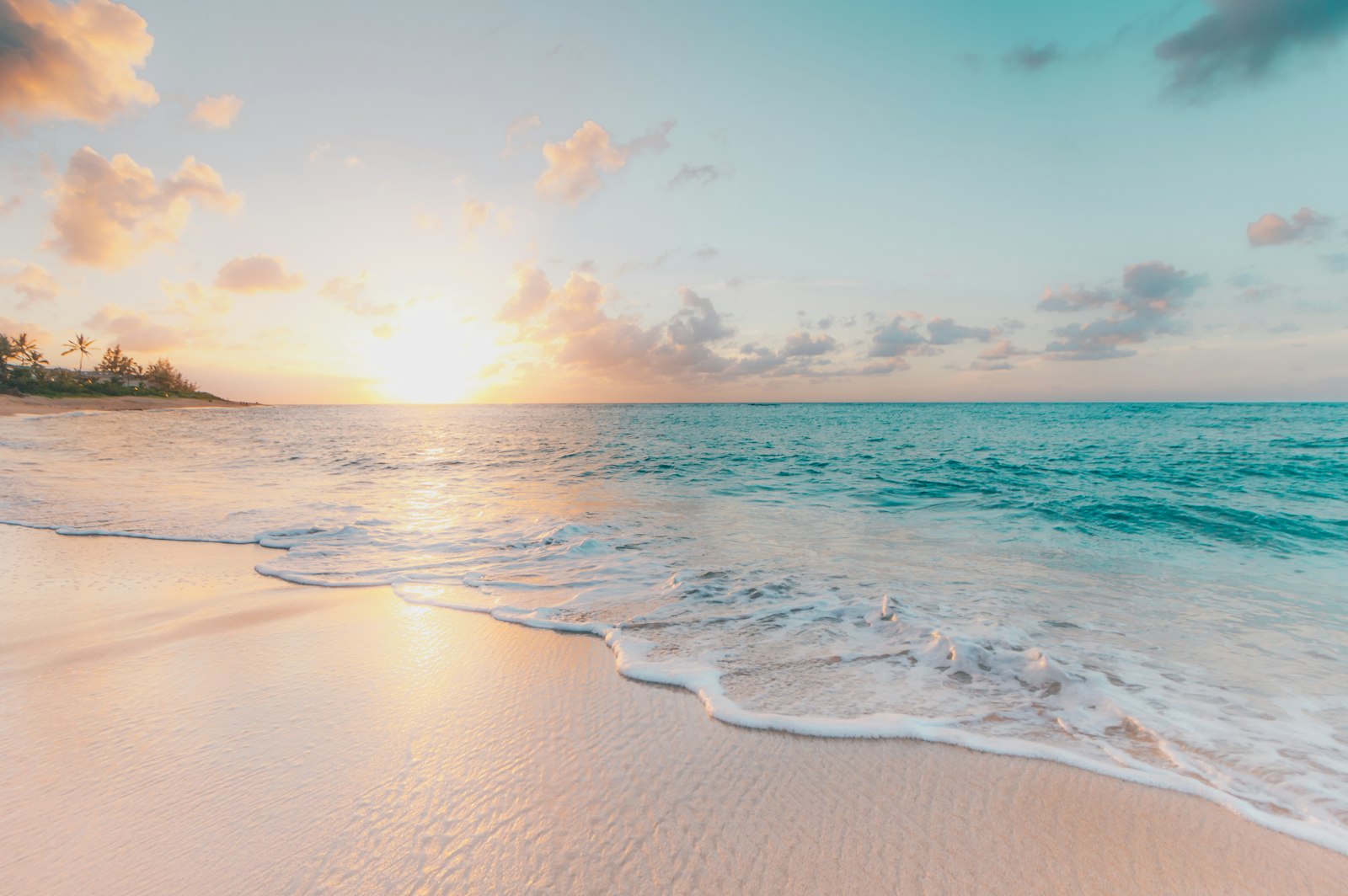 Couple walking on a sunny Florida beach — the perfect snowbird winter escape